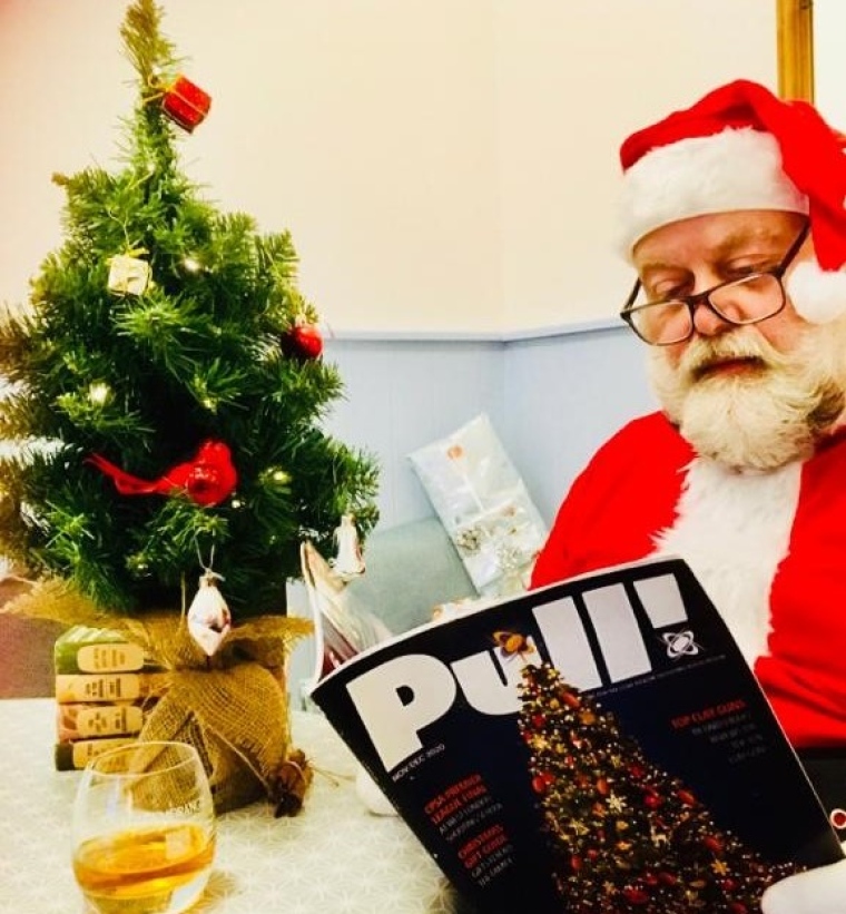 Father Christmas reading Pull! magazine